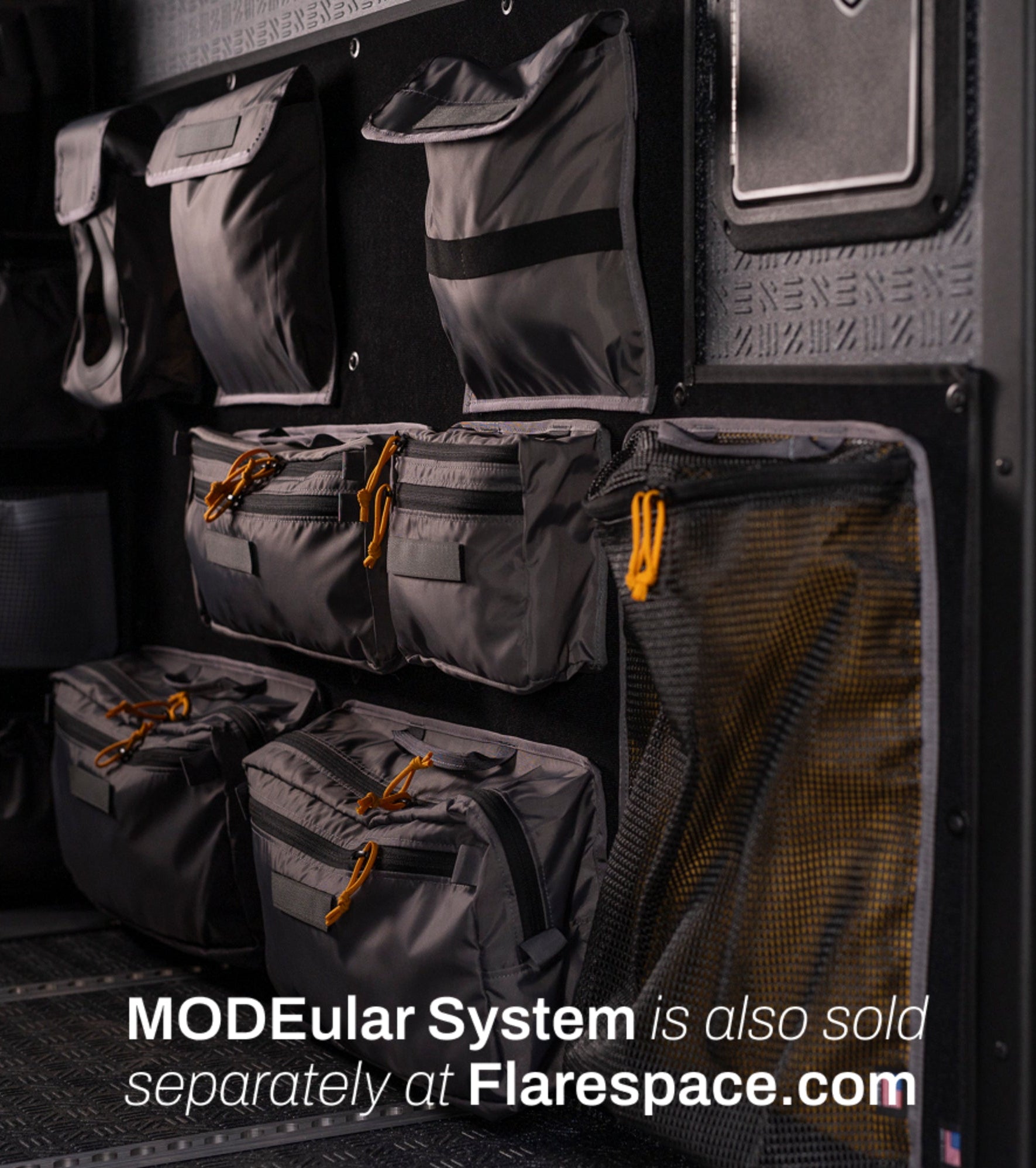 Modular storage system with organizer pouches inside camper van, ideal for van life, overland travel, and adventure van organization.