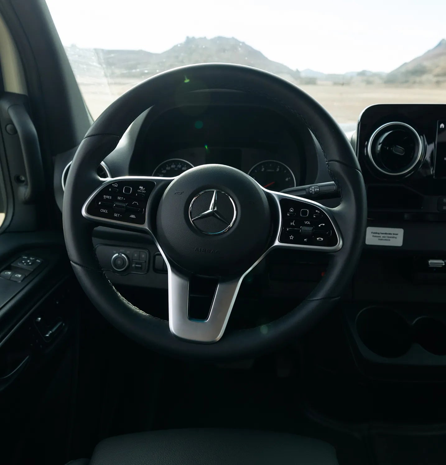 Mercedes steering wheel inside Sprinter Van for camper van, adventure van, overland vanlife