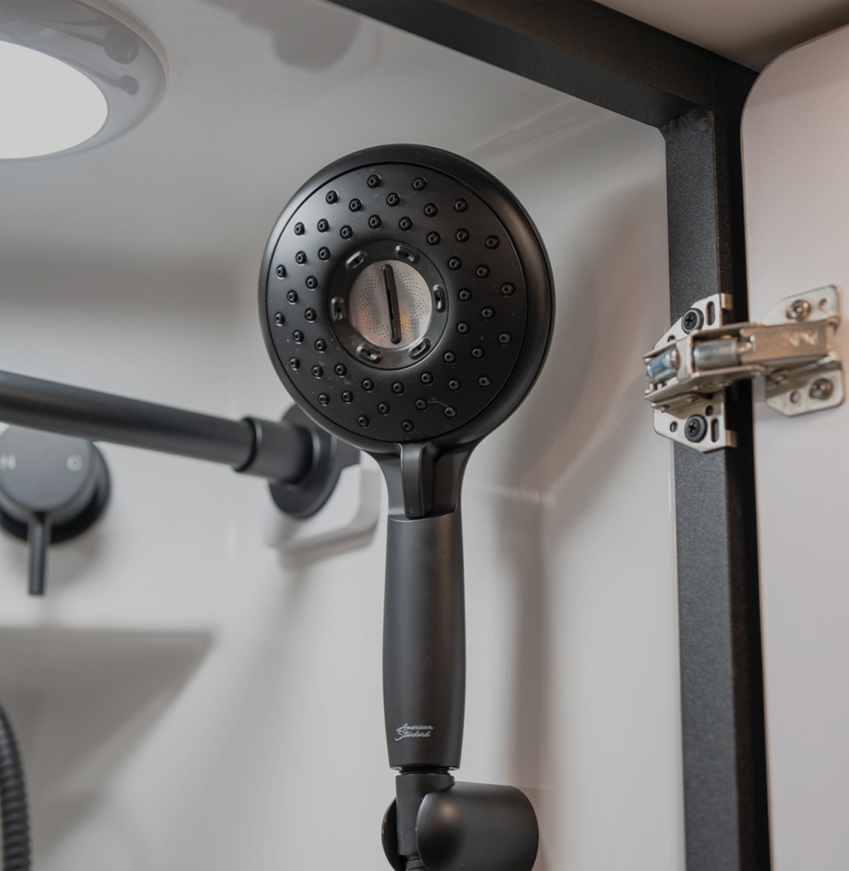 Modern showerhead in Class B RV camper van, ideal for vanlife, overlanding, road trips