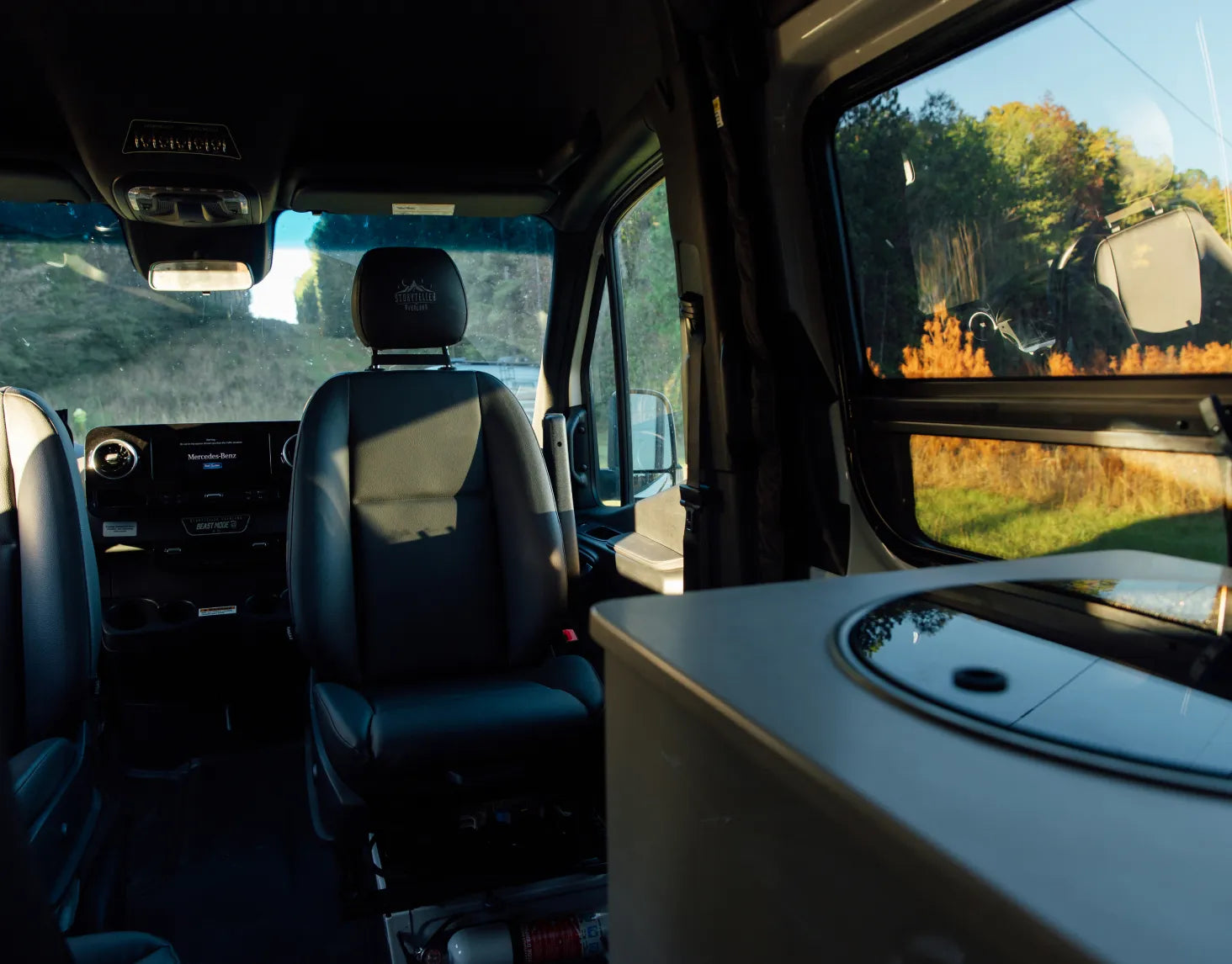 Modern interior of Classic MODE van adventure campervan with swivel seats and large window view