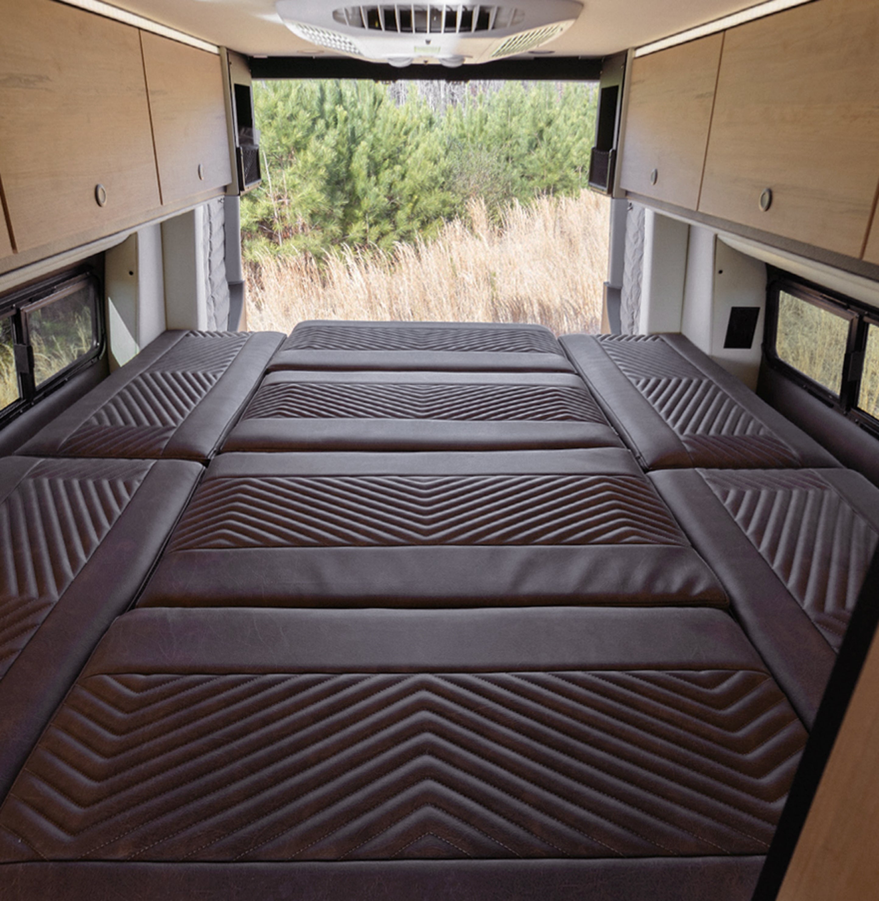Luxury bed setup inside Sprinter Van campervan with storage, for vanlife and overlanding