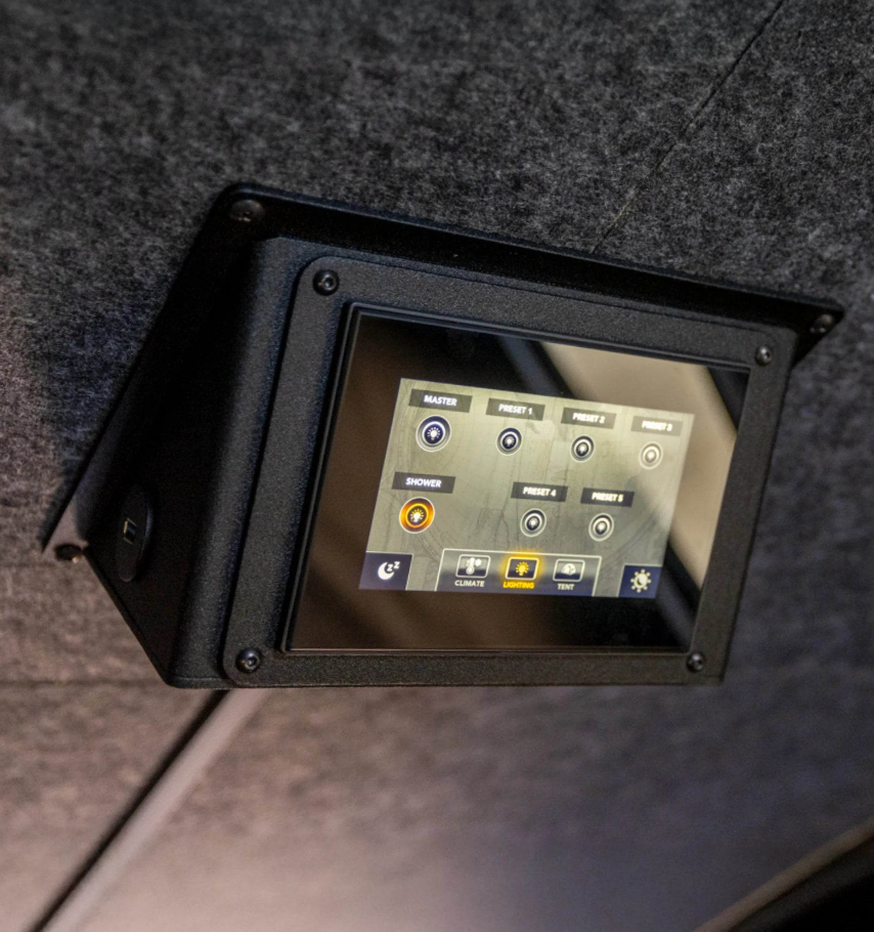 Touchscreen control panel in an adventure van, campervan, or Class B RV interior