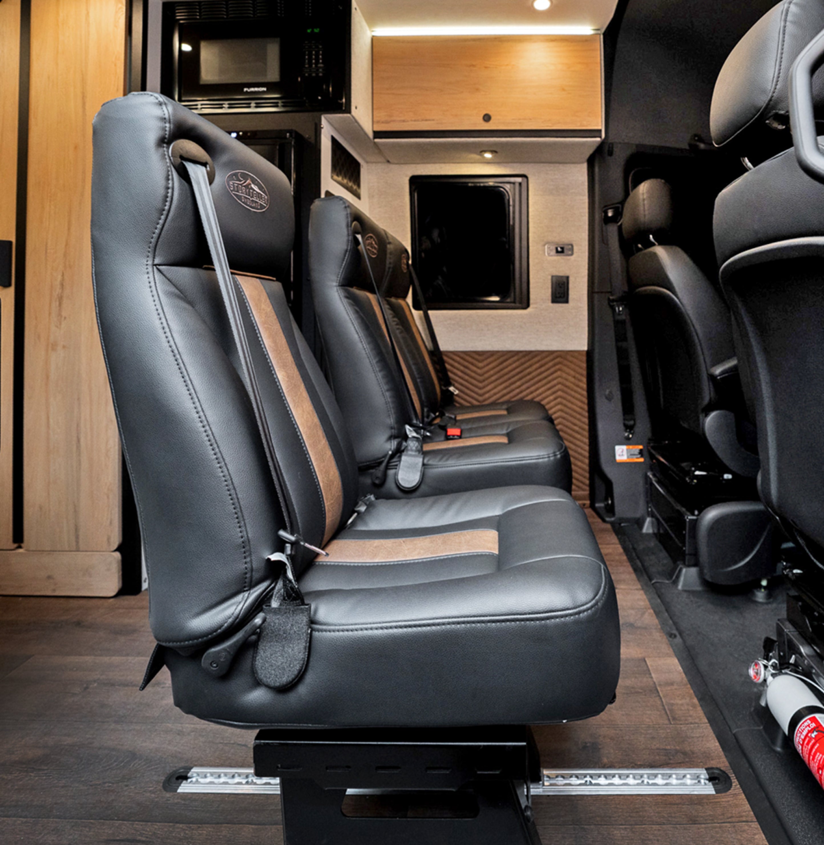 Custom leather seats inside a Class B Camper Van, ideal for overlanding, van life, adventure travel.