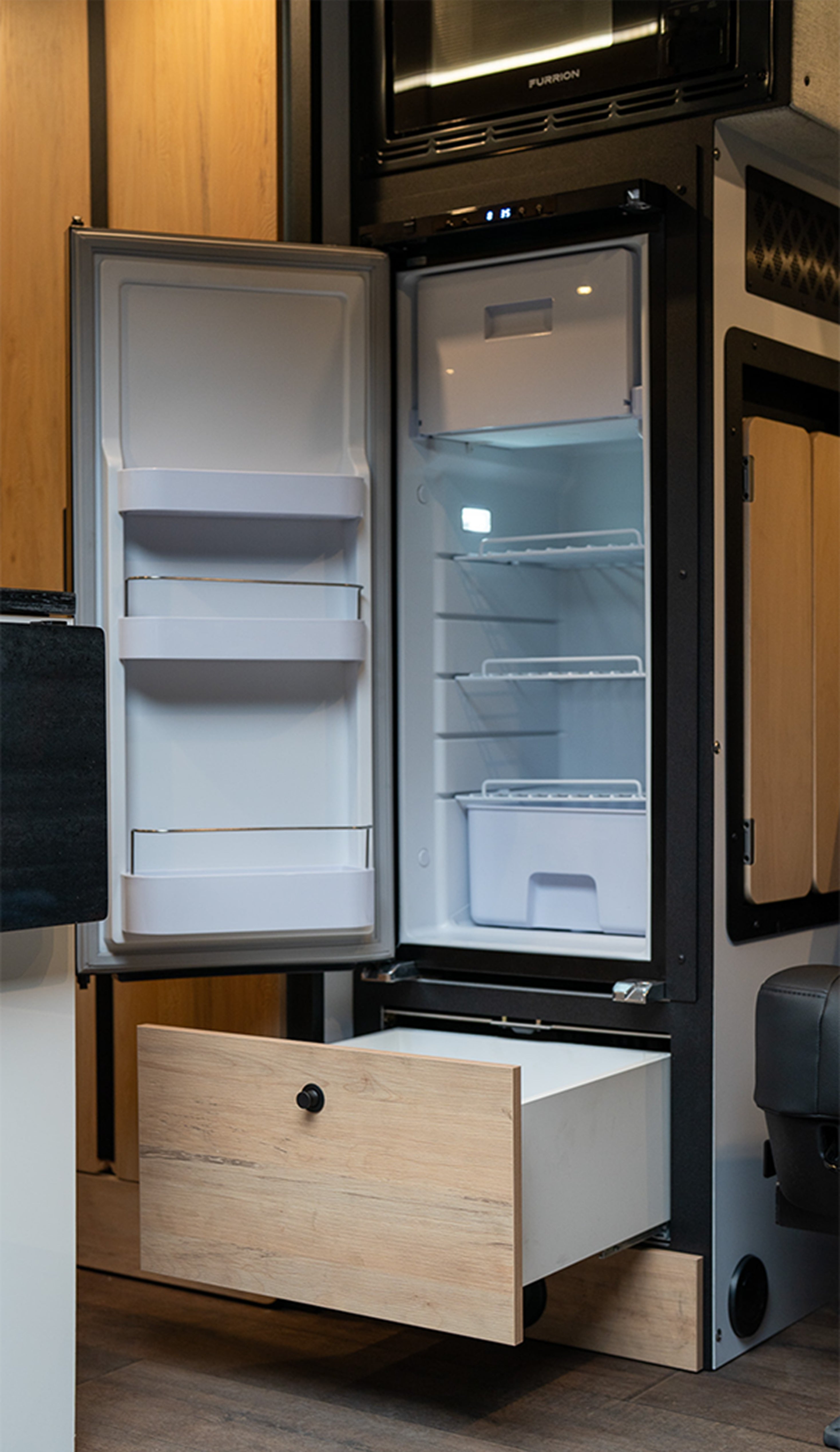 Interior fridge and storage drawer inside camper van, Class B RV, overland adventure rig