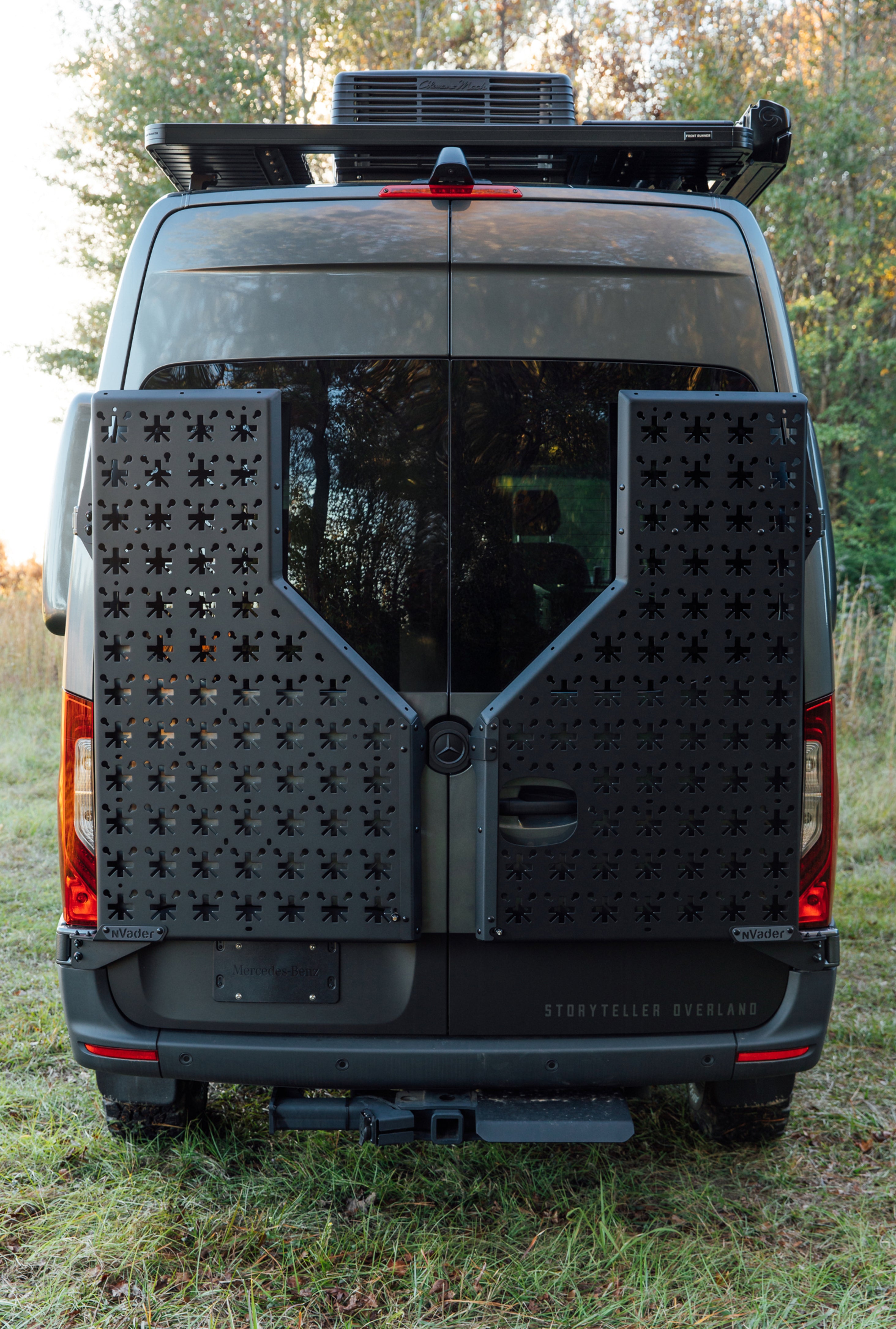 Rear view of a Stealth MODE adventure van with offroad storage panels, perfect for overlanding.