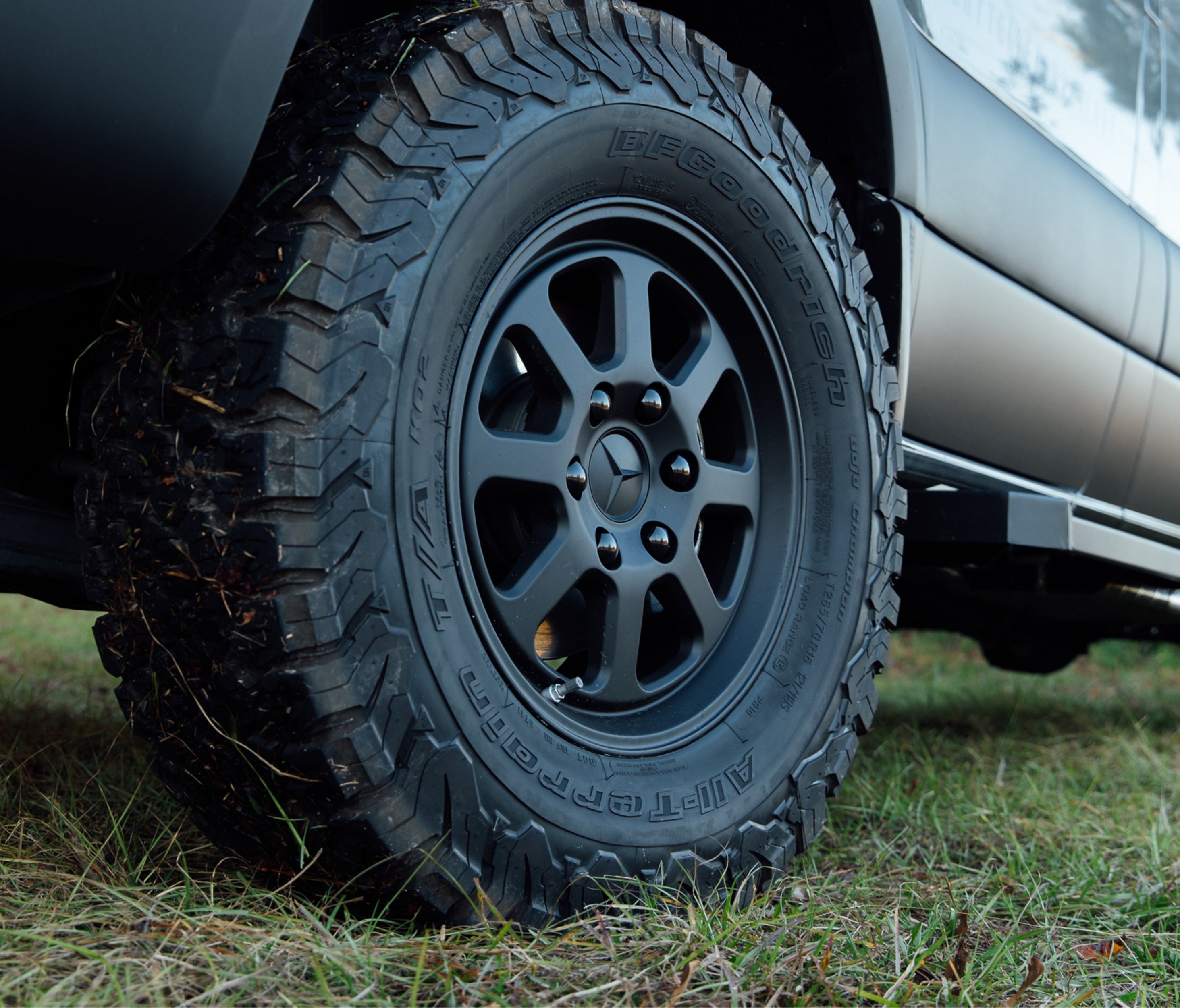 Close-up of rugged offroad tire on adventure van, ideal for overlanding and vanlife travel