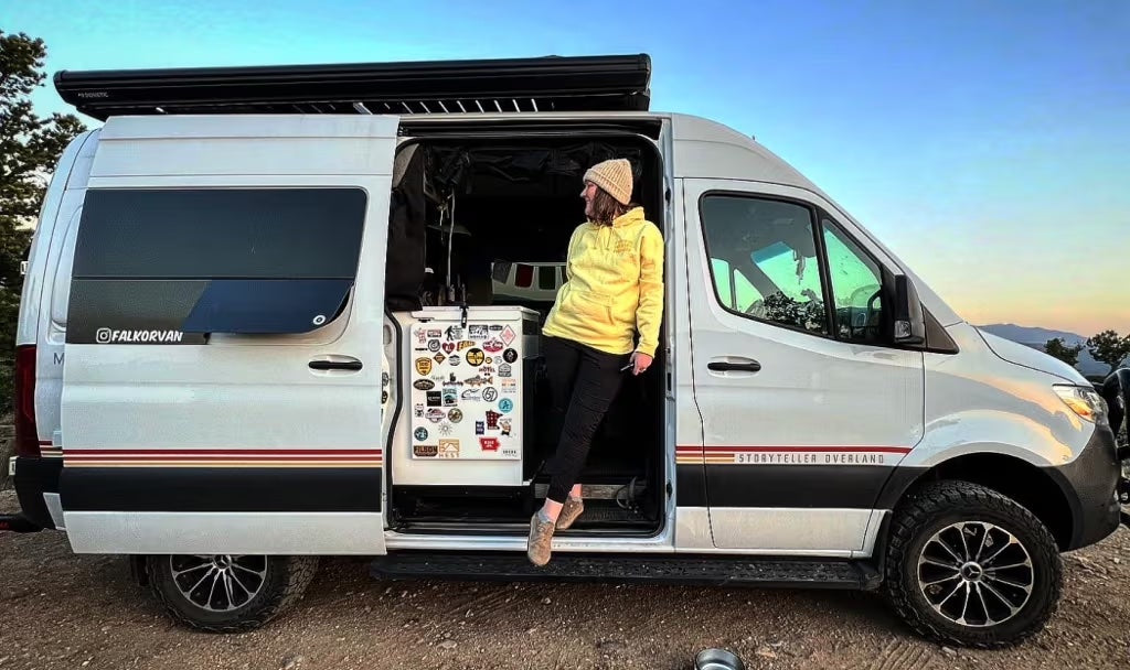 Person relaxing in a Sprinter Camper Van for vanlife, overland road trip adventure travel