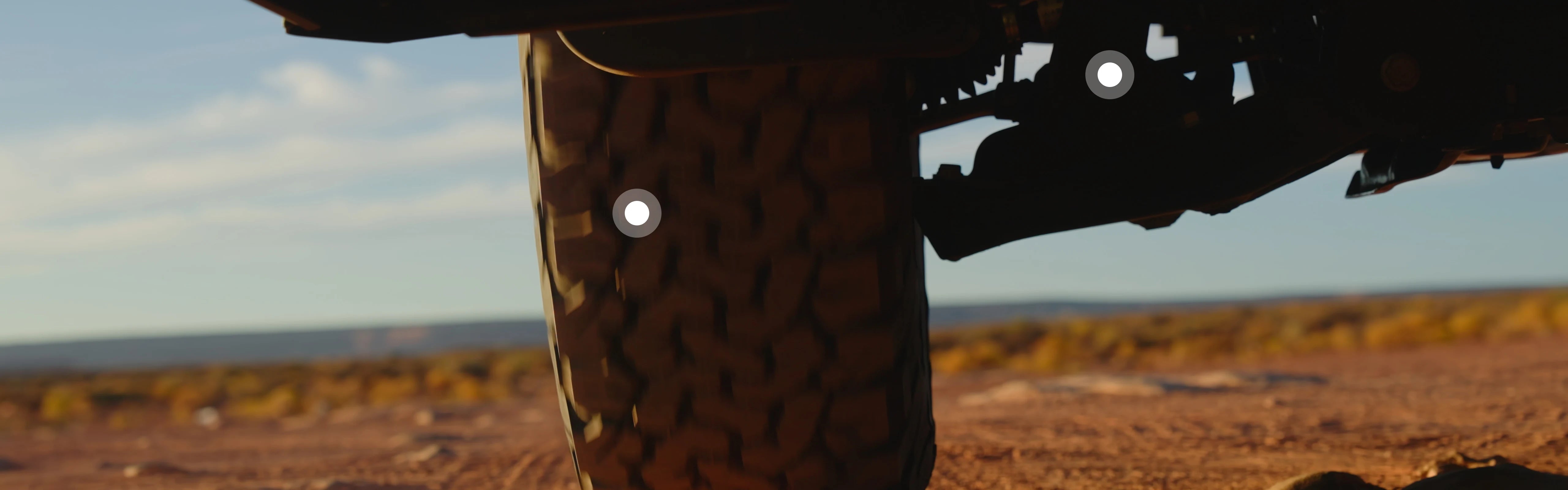 Off-road suspension and tire on adventure van for overland, campervan, vanlife travel