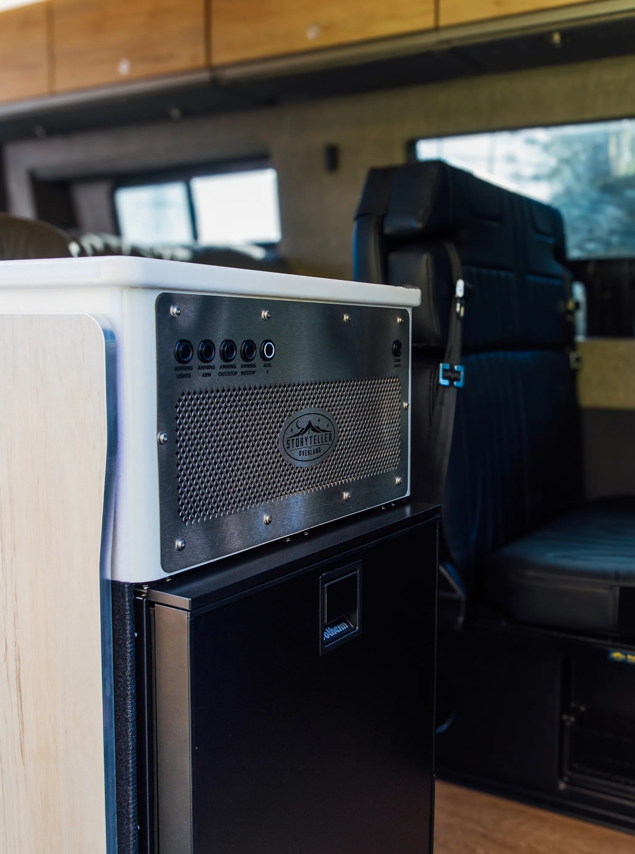 Modern control panel and seating inside luxury Camper Van, Class B RV, Adventure Van, Vanlife interior.