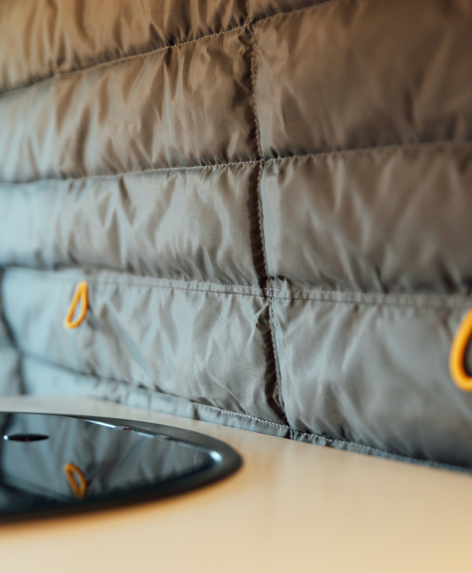 Insulated quilted divider panel inside camper van, ideal for van life, overland, road trip.
