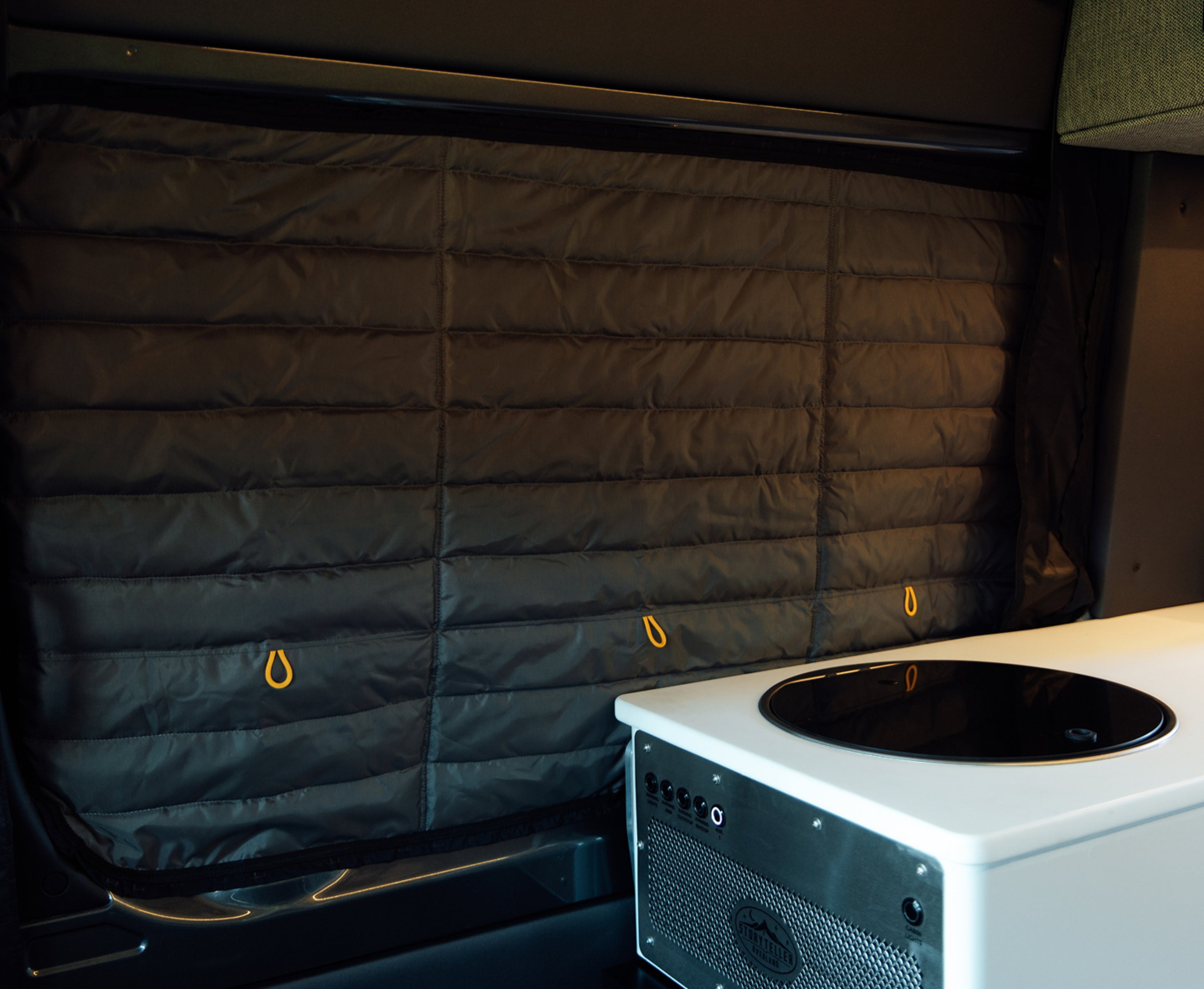 Insulated privacy window cover inside adventure van, ideal for camper van or vanlife travel.