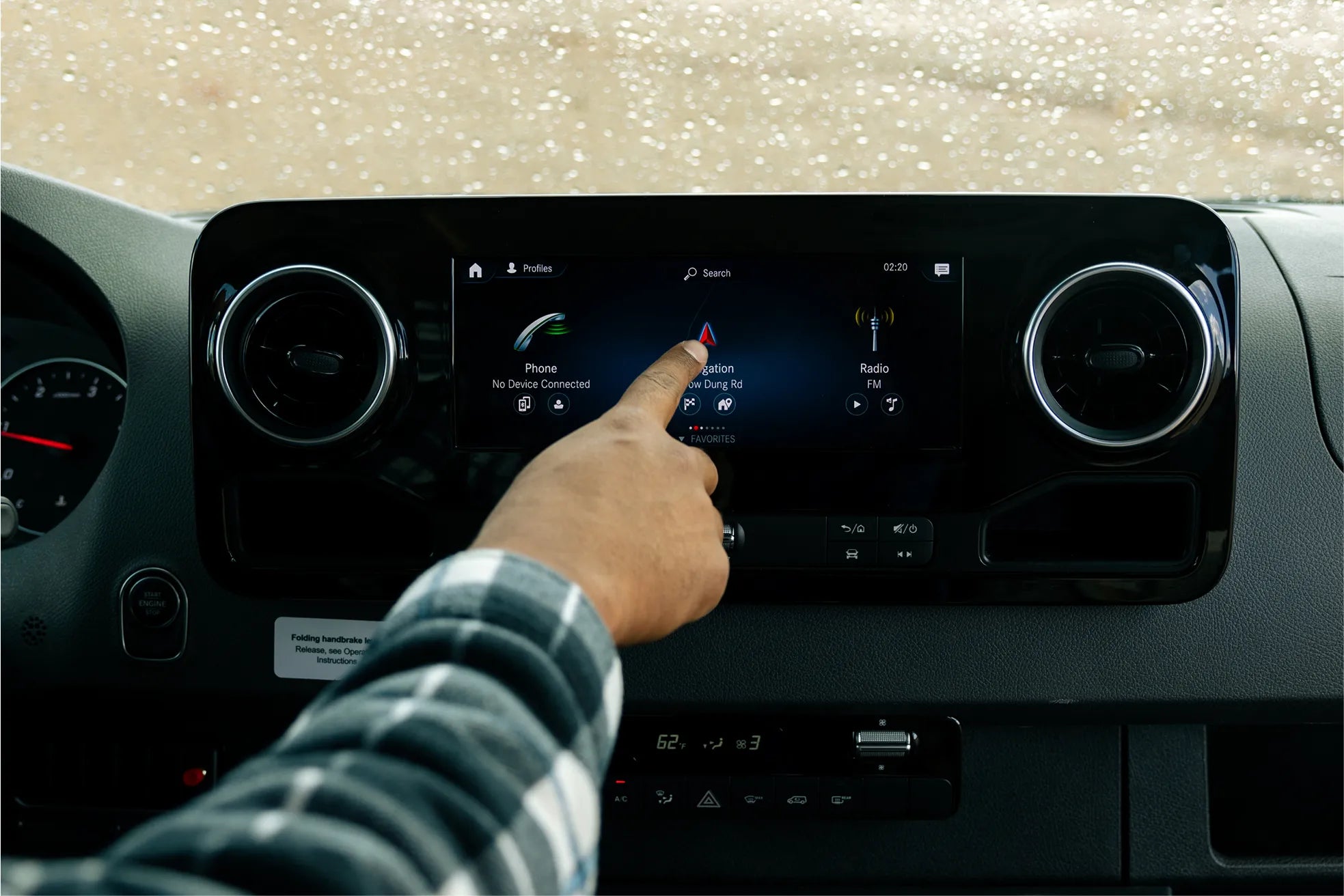 Touchscreen navigation system in Sprinter 4x4 camper van dashboard for vanlife adventure travel