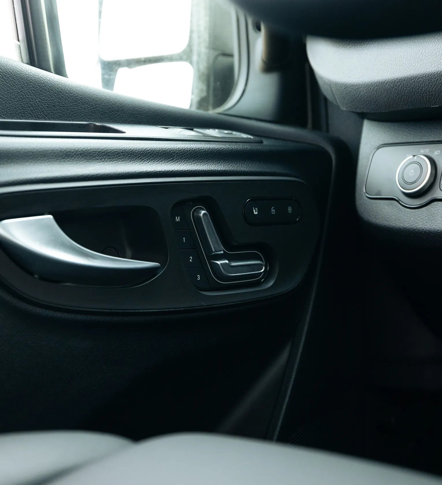 Premium interior door and seat controls inside adventure van, ideal for campervan, overland travel