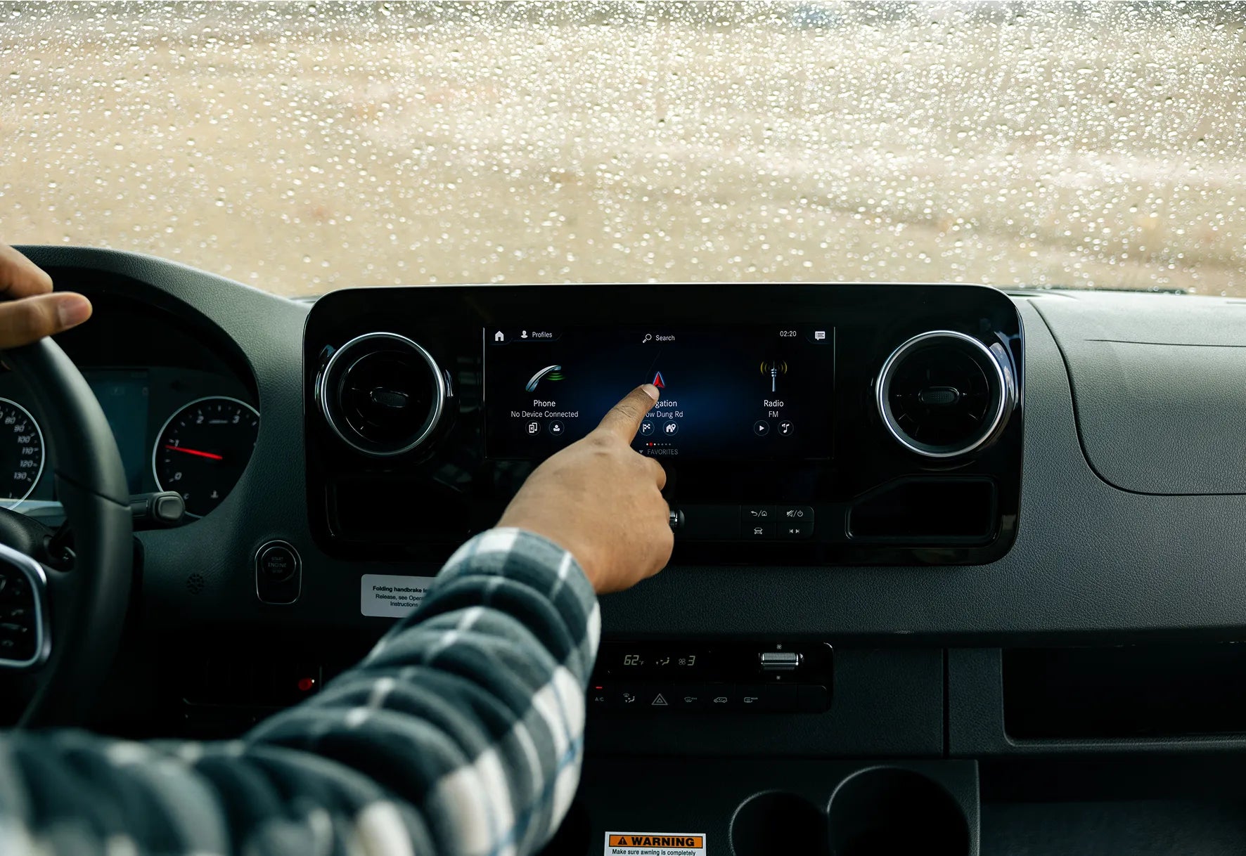 Camper van interior dashboard with touchscreen display, ideal for overlanding and vanlife adventures.
