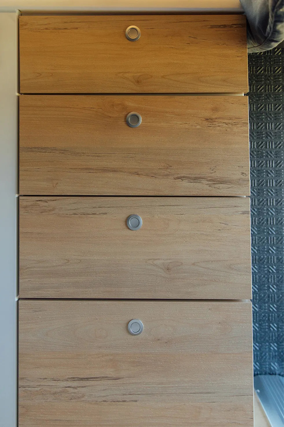 Modern wood drawers inside camper van, perfect for vanlife, overlanding, adventure van storage.