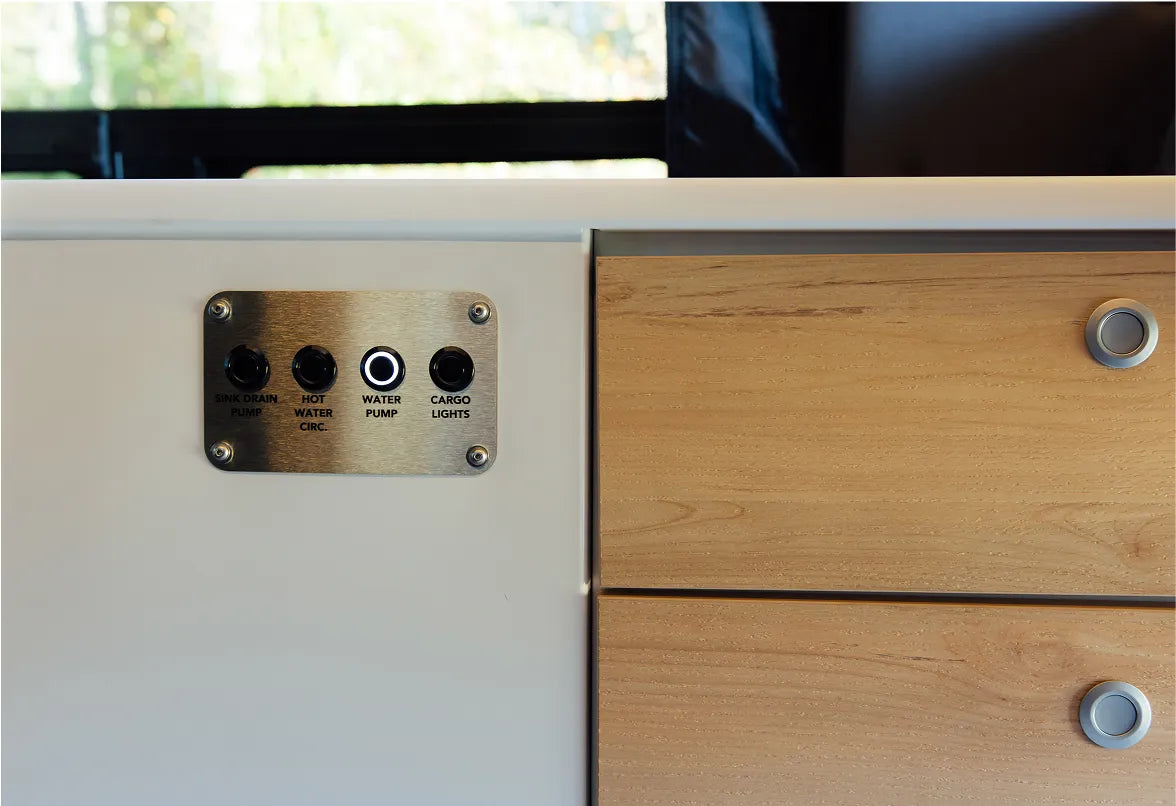 Mode camper van interior control panel with water pump and cargo lights, custom van conversion