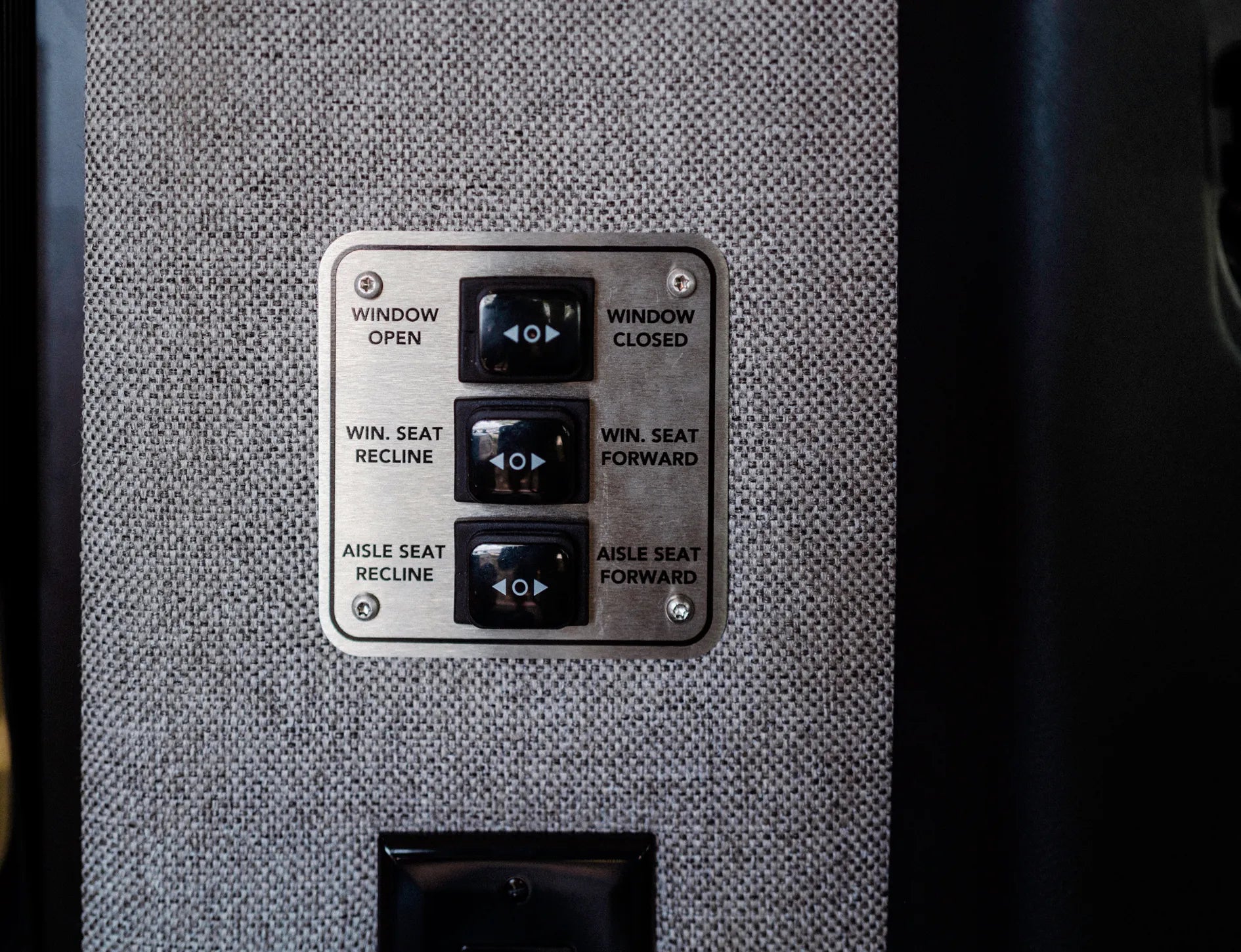 Camper van interior seating and window control panel, ideal for adventure van or overland travel.