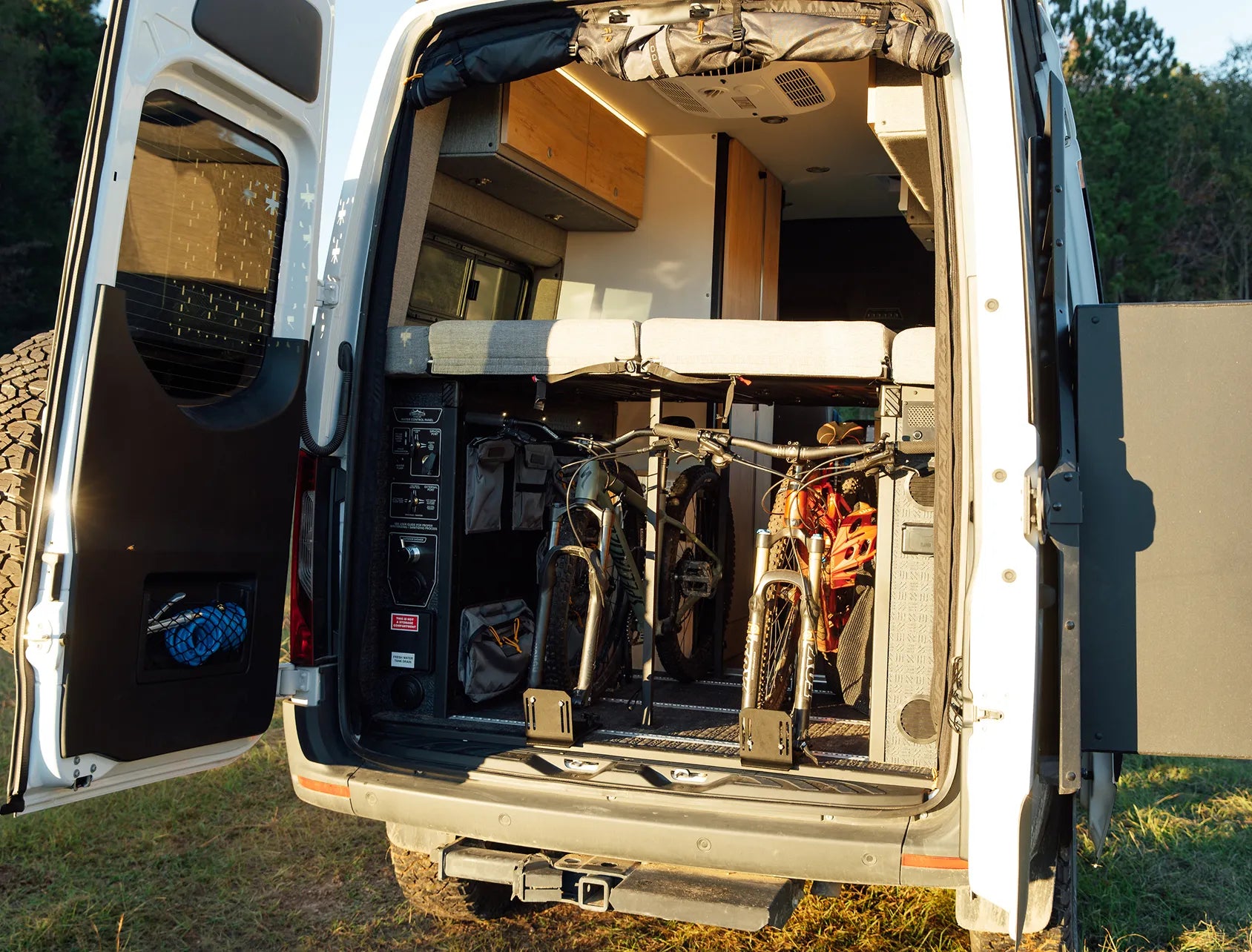 Adventure van interior trunk with bikes loaded, ideal for campervan, vanlife, road trip travel.