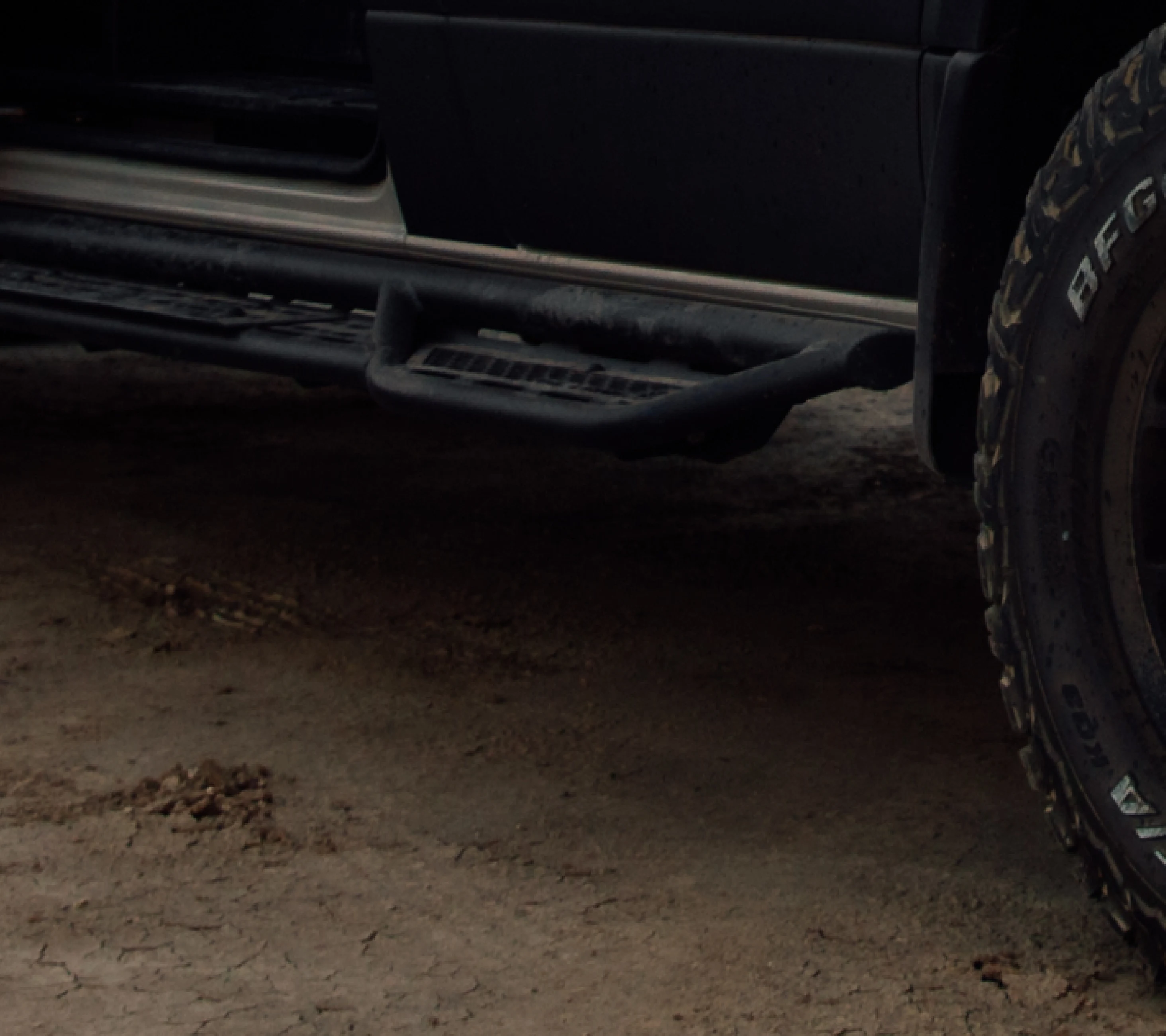 Offroad camper van rugged side step and all-terrain tire for overland adventure travel