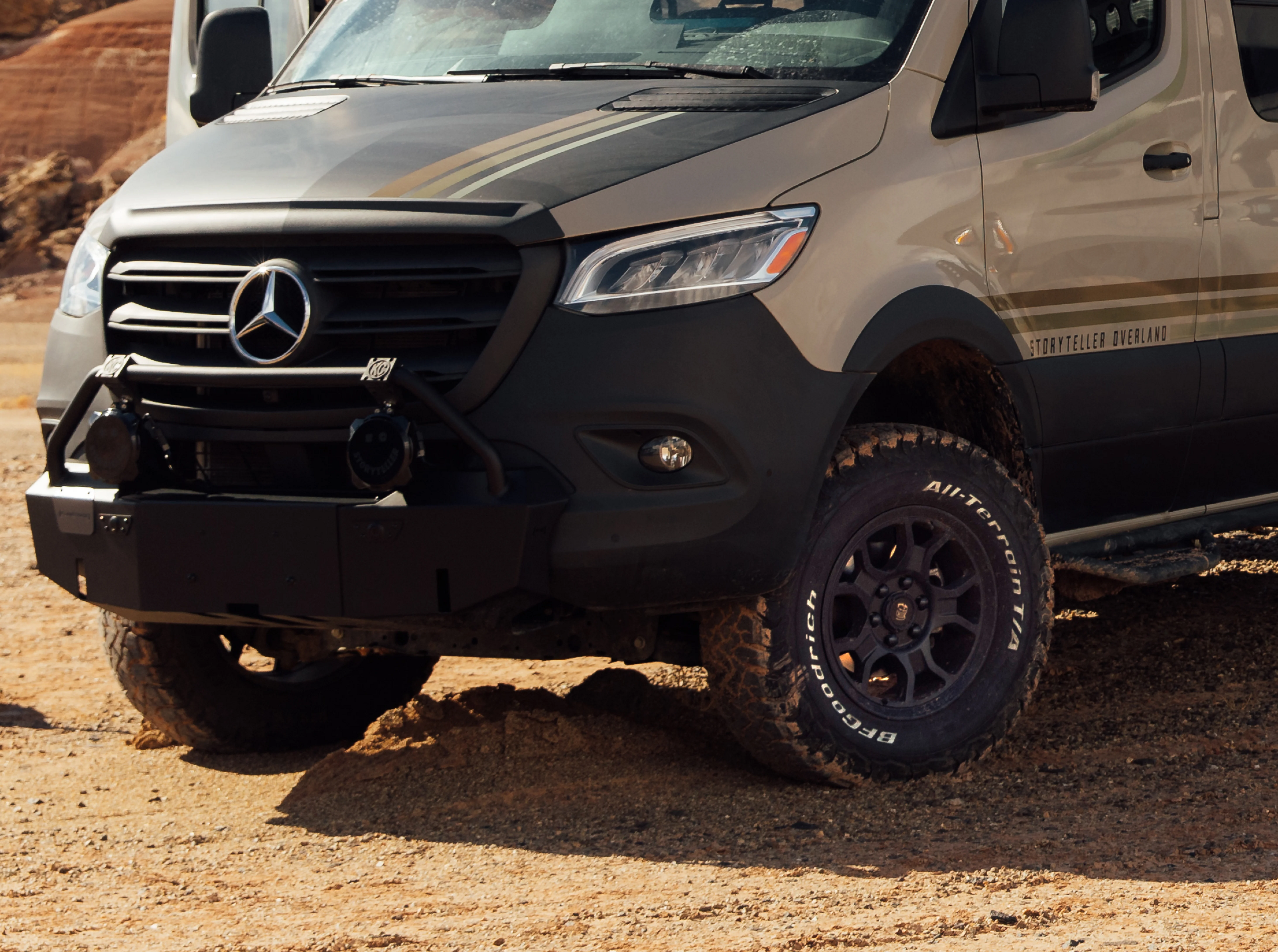 Beast MODE 4x4 Sprinter camper van front view, offroad adventure van on rugged terrain