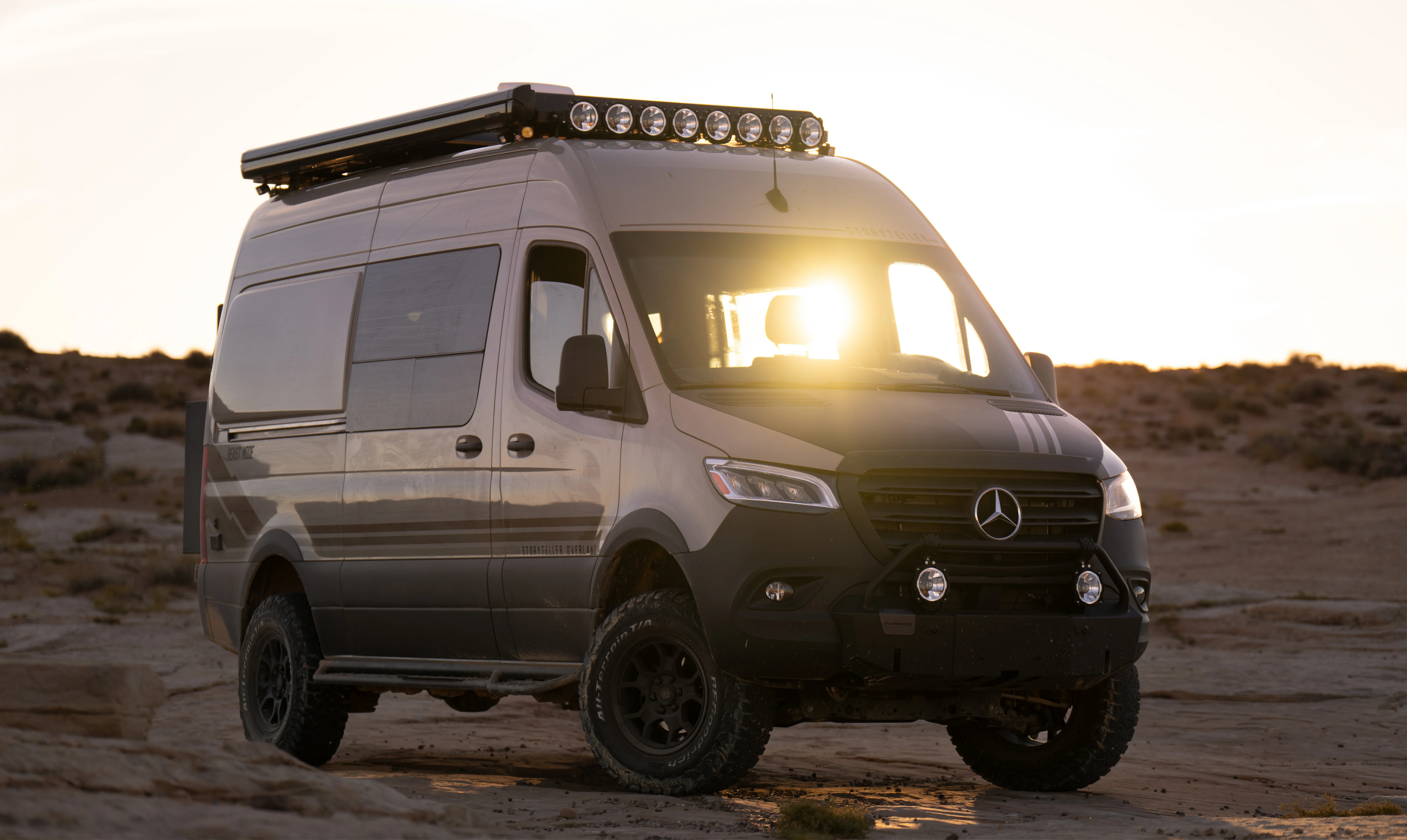 Beast MODE Sprinter 4x4 adventure van offroad at sunset, ideal for overlanding and vanlife.