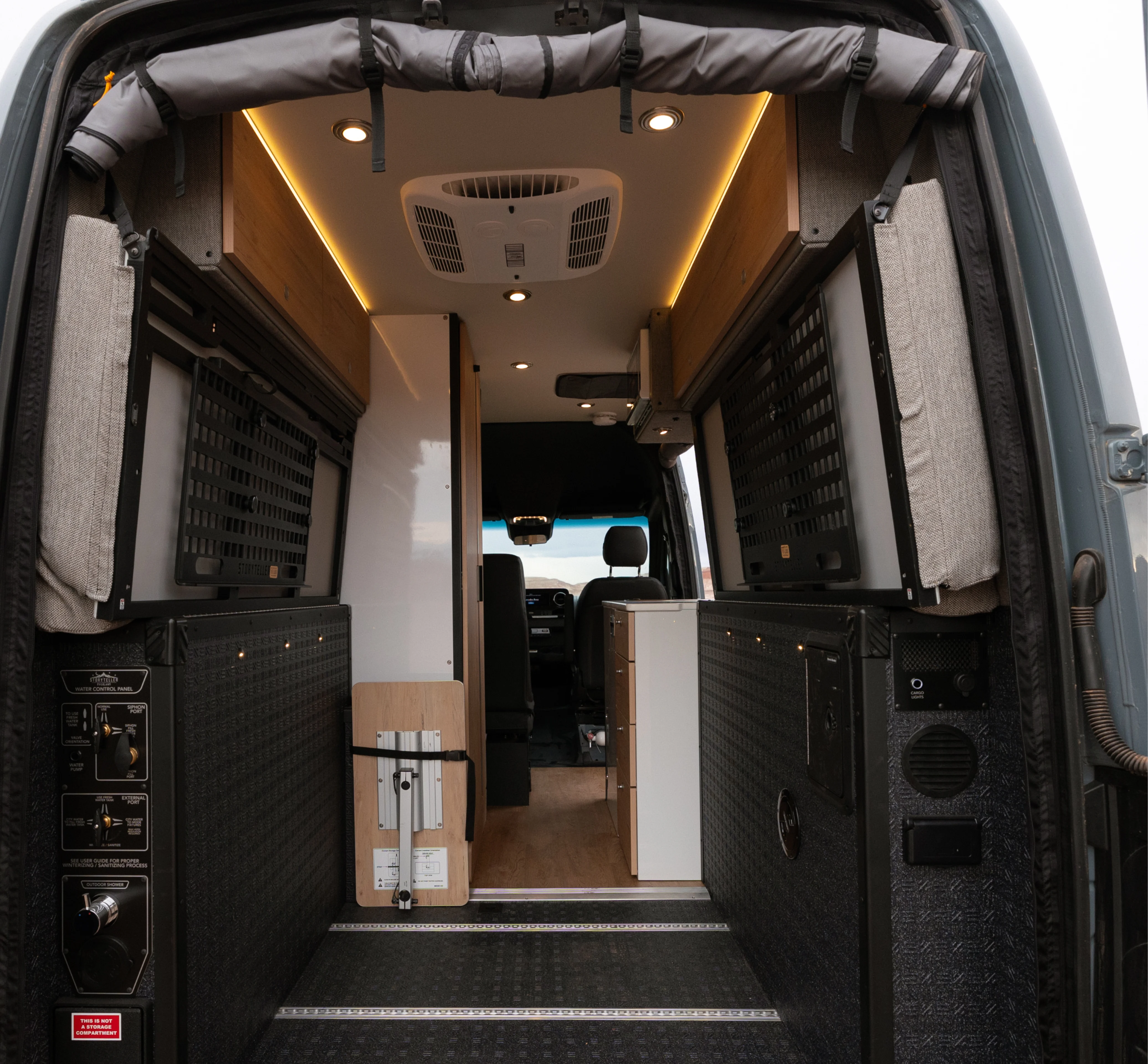 Interior of an adventure van, Beast MODE campervan with storage, seating, and modern LED lighting