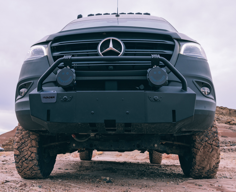 Beast MODE 4x4 Sprinter Van offroad adventure camper van with rugged bumper on dirt trail