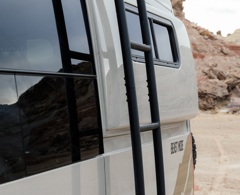 Beast MODE camper van side with ladder, offroad van for adventure travel and vanlife