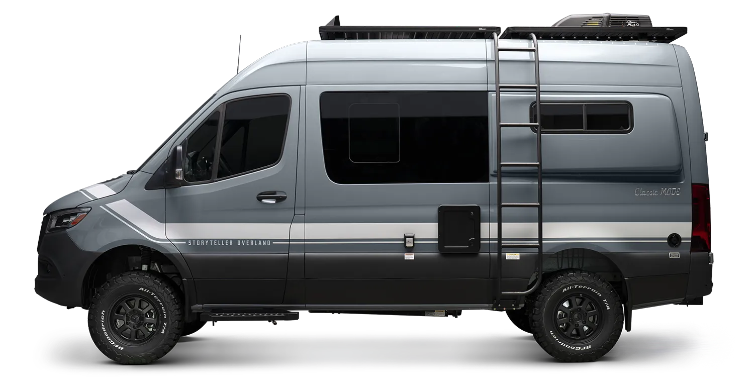 Side view of blue-grey Sprinter 4x4 camper van with ladder, ideal for vanlife and overlanding.