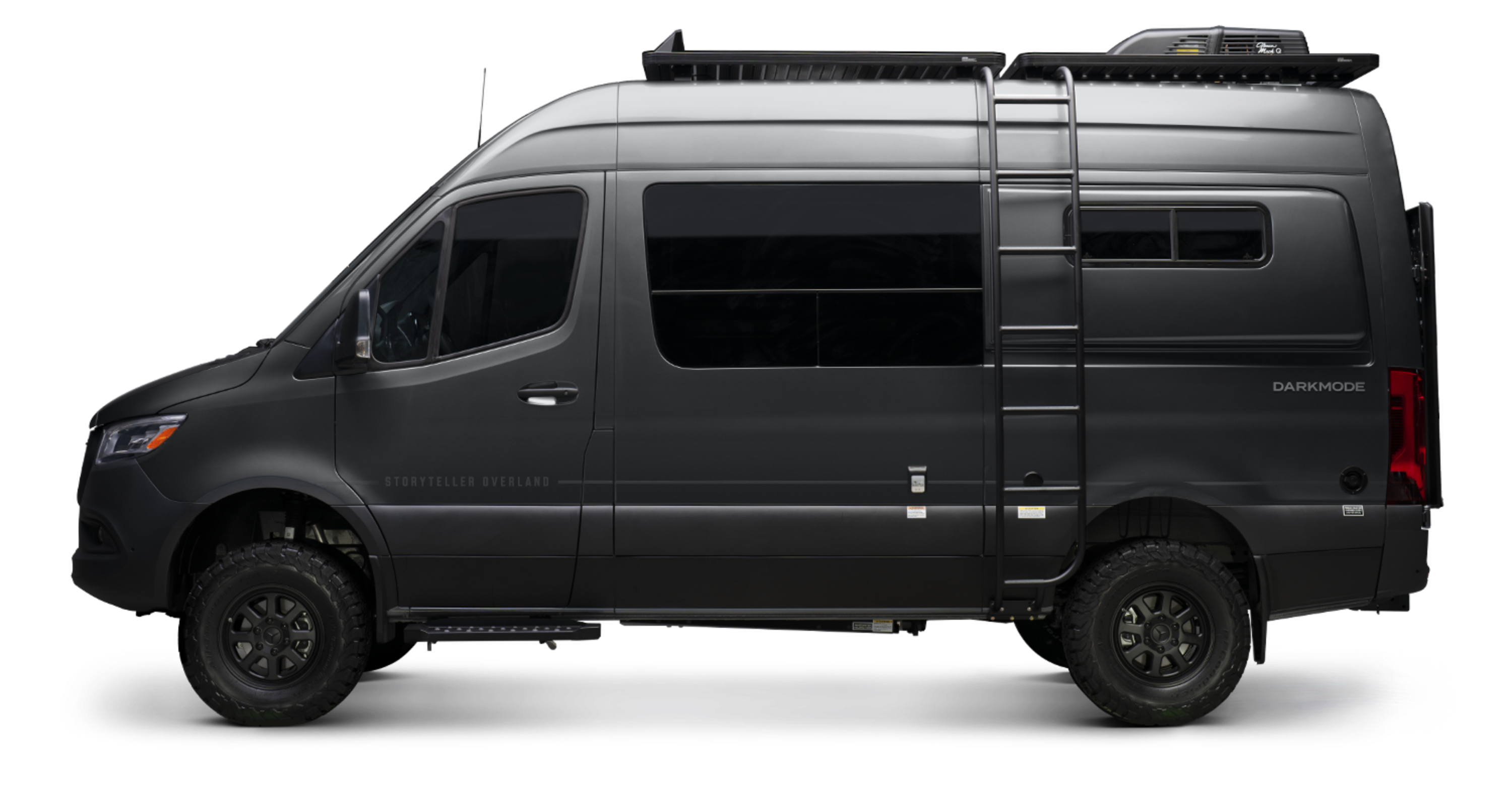 Side view of black offroad Sprinter 4x4 camper van with ladder and rugged wheels, ideal for vanlife and adventure travel.